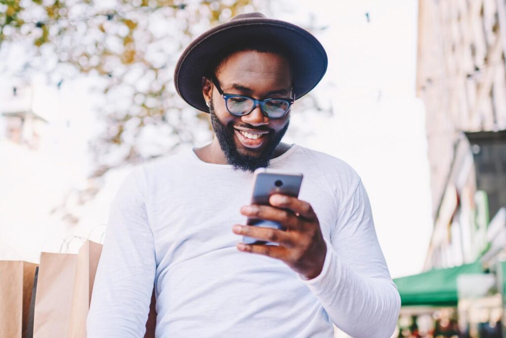 A man laughing at good instagram captions