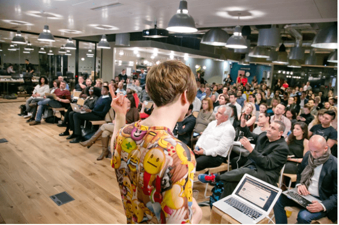 Austen Allred speaking in London, England on growth hacking Instagram