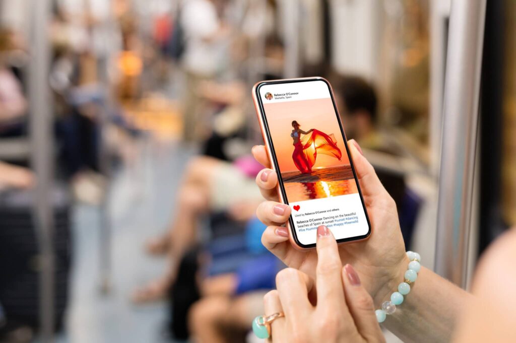 Woman riding in a metro and scrolling Instagram