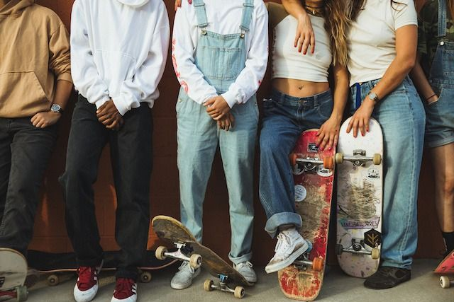 skaters style, wearing baggy jeans, adidas and vans sneakers 