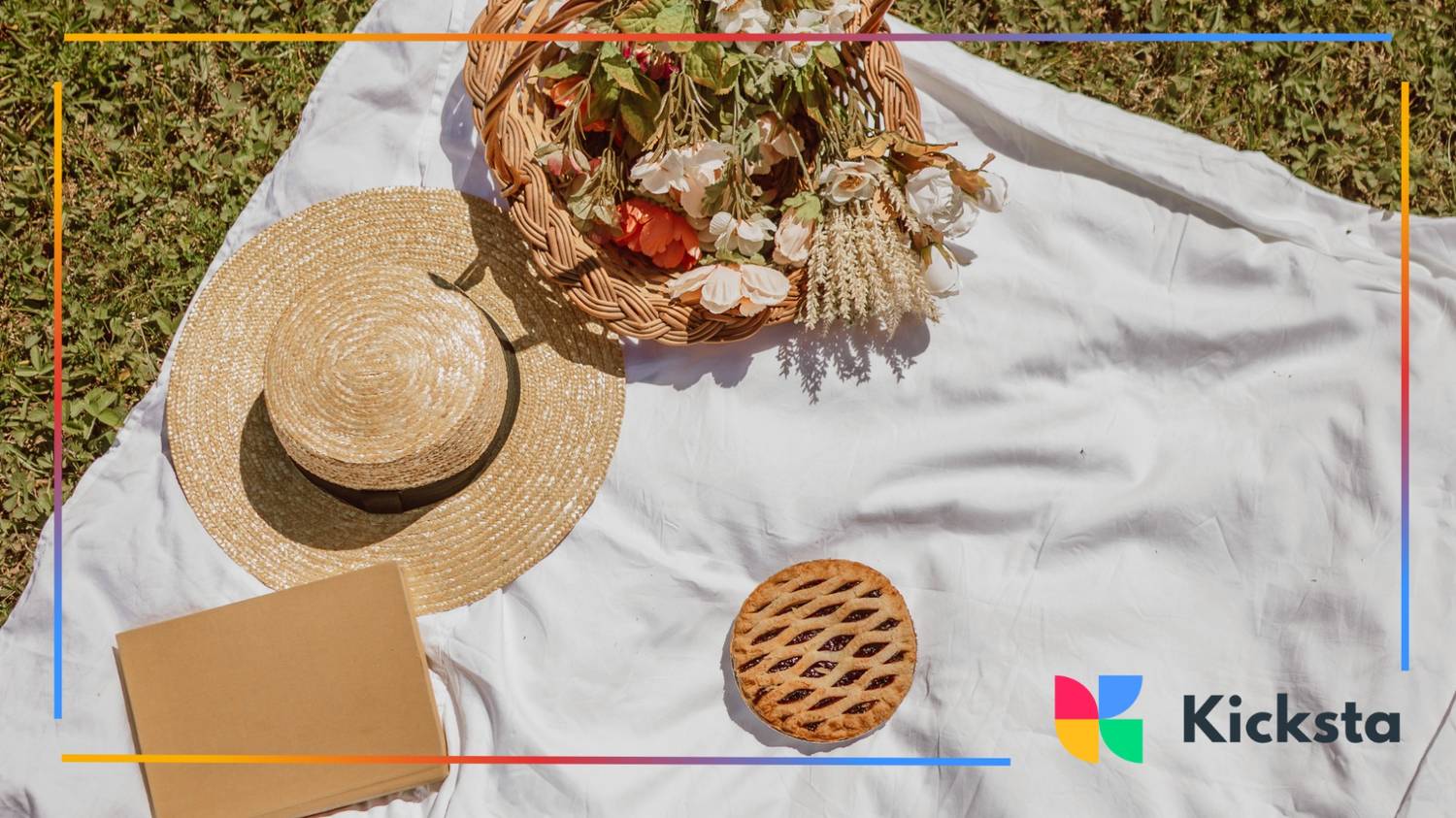 Aesthetic picnic with flowers, hat, book, and pie