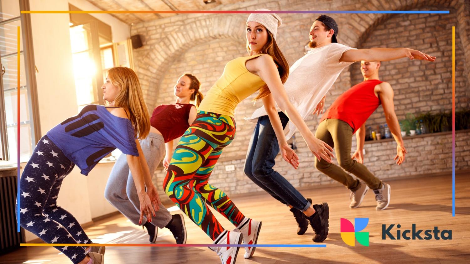 Modern dance class practicing in studio